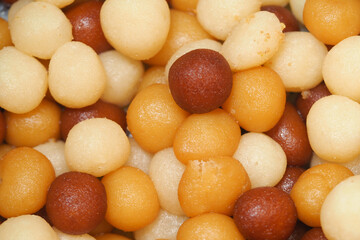 Assorted Sweet Balls in Varied Colors Arranged for a Vibrant Food Display