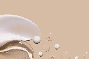 samples of cosmetic care products smear of cream texture on a beige background
