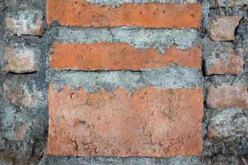 Textured Old Brick Wall with Cement Patches