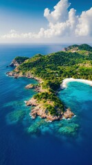 Naklejka premium Aerial view of a tropical island with lush greenery, rocky shores, and clear turquoise waters under a bright blue sky.