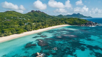 Tropical beach view, vibrant turquoise waters meeting sandy shore, lush greenery and clouds overhead, ideal for relaxation and nature themes.