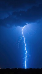 Electric blue lightning bolt illuminating dark stormy sky, electricty, weather, nature