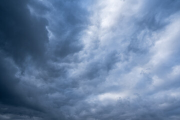 A captivating and mesmerizing view of turbulent, stormy overcast skies showcasing dynamic and...