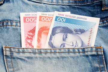 Old German Mark in the pocket of blue jeans