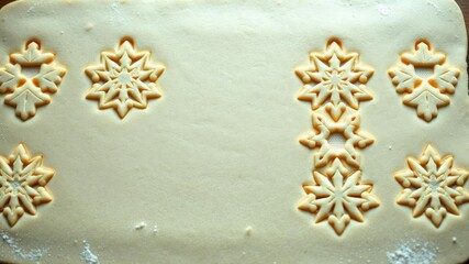 Pastry dough sheet with intricately cut Linzer Christmas cookie design, gingerbread, christmas cookies