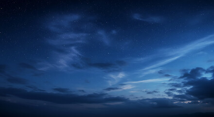 Deep Blue Twilight Sky with Soft Clouds and Stars
