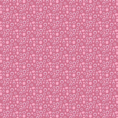 Seamless pattern with pink circles on a pink background. Vector illustration.