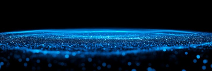 Abstract background featuring a vibrant blue glow effect against a dark backdrop with a grainy texture