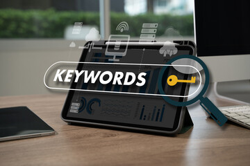keywords on laptop browse in office optimize seo engine man is using a tablet to type the word "keywords"