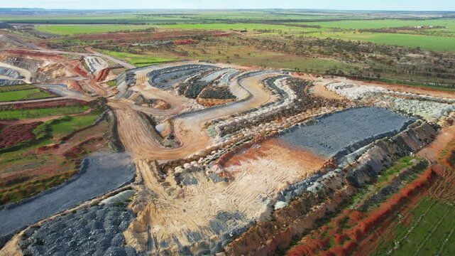 Aerial view of talc mine excavation site with beautiful patterns and shapes in the landscape, Three Springs, Australia.