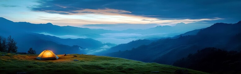 Fototapeta premium Peaceful mountain landscape at dawn with glowing tent, rolling hills, misty valleys, and dramatic sky over serene wilderness