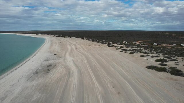 Aerial view of serene and pristine Shell Beach with sandy shore and blue ocean, Shark Bay, Gascoyne Region, Australia.