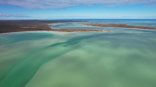 Aerial view of serene turquoise waters and pristine coastline at Big Lagoon in Francois Peron National Park, Denham, Australia.