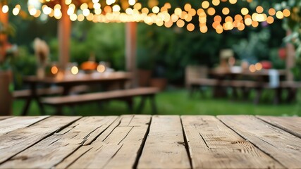 Wooden table in a garden, illuminated by glowing fairy lights