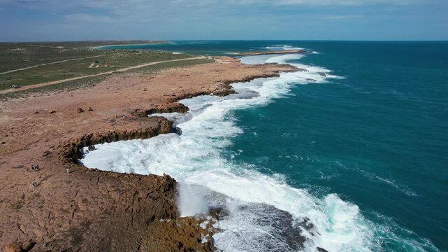 Aerial view of the rugged coastline with Quobba blowholes and crashing waves, Carnarvon, Australia.