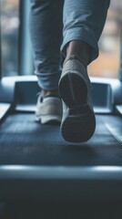 Steps to Fitness: A Close-Up of Feet on a Treadmill