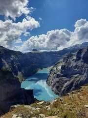Fototapeta premium Magic photo of a lake reflecting the mountains during a hike in the Swiss Alps