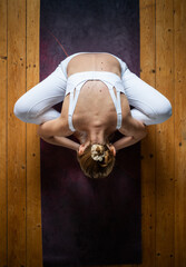 top view of woman doing yin yoga