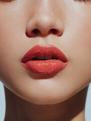 Naklejka premium Close-up of lips with cherry red pink lipstick or lip gloss