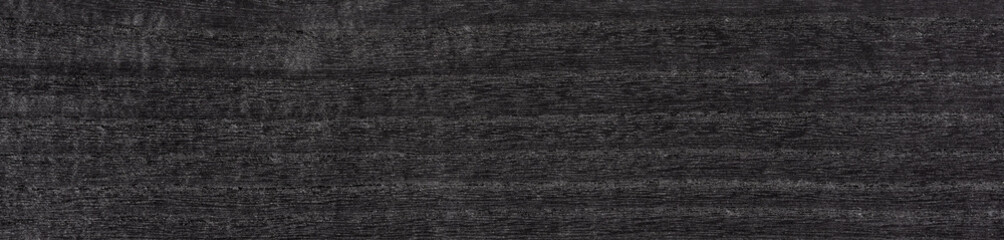 Sleek ebony veneer exudes sophistication with its deep charcoal and onyx tones woven into a smooth texture