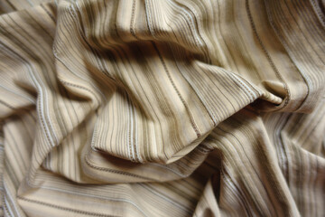 Crumpled beige and grey hairline striped cotton fabric