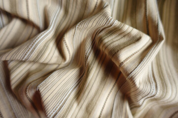 Draped beige and grey hairline striped cotton fabric