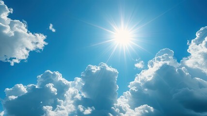 Bright sun shining over fluffy white clouds in a blue sky