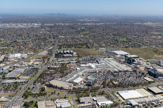 Aerial view of bustling cityscape with modern buildings and organized roads, Epping, Melbourne, Australia.