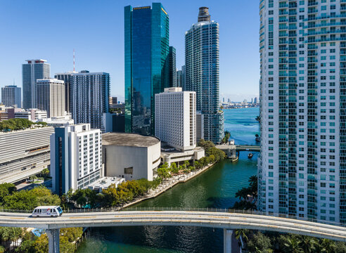 Miami, United States - 30 January 2022: Aerial view of beautiful skyscrapers and a bridge over the Miami River in a sunny cityscape, Brickell, United States.