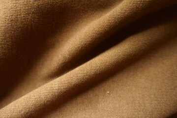 Folded chocolate brown warm jersey fabric