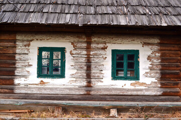Facade of a house in Bukovina, Ukraine. Wall and windows, picturesque, background