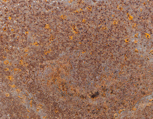 Rusty background, metal texture. Metal oxidizes with age. Rusty surfaces. Close-up from above.