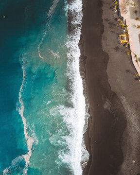 Aerial view of beautiful Playa de Puerto Naos beach with sandy shore and ocean waves, Los Llanos de Aridane, Spain.