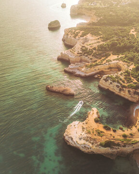 Aerial view of Praia da Morena with beautiful cliffs and serene coastline, Porches, Portugal.