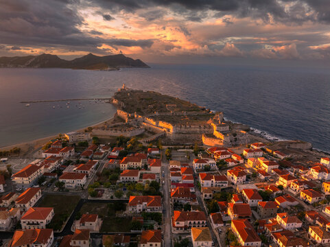 Aerial view of ancient medieval fortress by the sea at sunrise, Methoni, Greece.