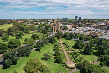 Aerial view of st peter's cathedral and pennington gardens surrounded by greenery and urban landscape, north adelaide, south australia.