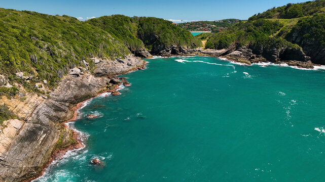 Aerial view of lush tropical islands and beautiful coastline with cliffs and ocean, Armacao dos Buzios, Brazil.