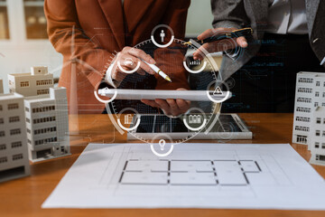 Asian business people using tablet for working technology and business, Renewable energy-based...