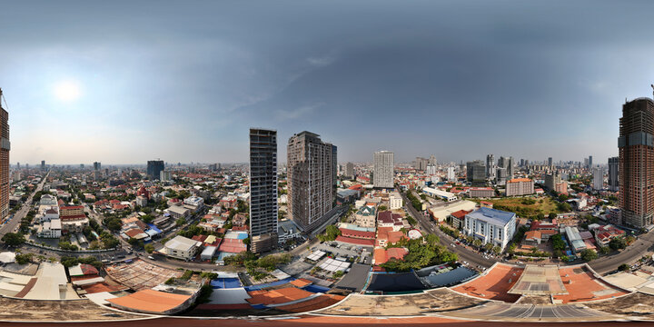 Aerial view of a bustling urban landscape with high-rise buildings and a vibrant skyline, Toul Kork District, Cambodia.