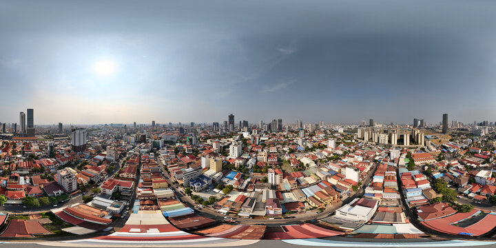 Aerial view of vibrant cityscape with modern high-rise buildings and expansive rooftops, Toul Kork District, Phnom Penh, Cambodia.