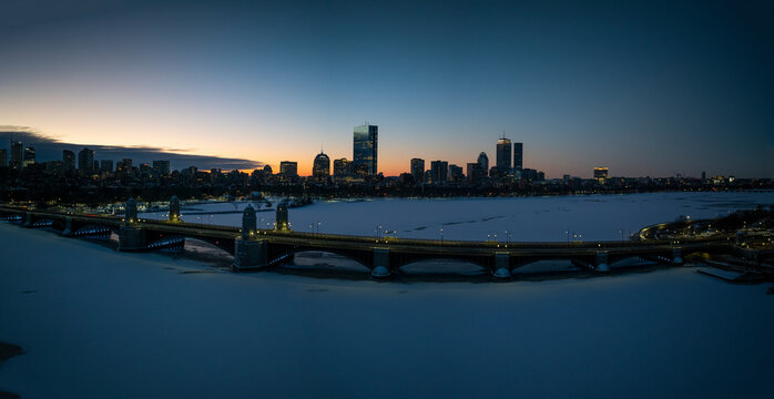 Aerial view of longfellow bridge over charles river with boston skyline at sunset, massachusetts, united states.