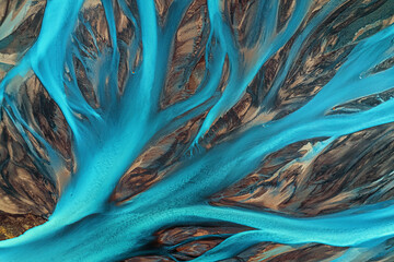 Aerial view of a beautiful stream flowing through a scenic landscape with natural patterns, Kirkjubaejarklaustur, Iceland.