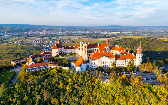 Aerial view of historic Stift Goettweig monastery and church surrounded by autumn landscape and vineyards, Krems, Austria.