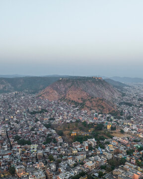 Aerial view of beautiful cityscape with residential buildings and scenic hills, Subhash Nagar, Jaipur, Rajasthan, India.