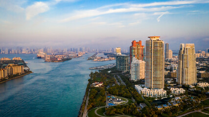 Aerial view of vibrant cityscape with modern skyscrapers and beautiful coastline, Miami Beach, United States.
