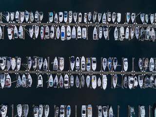 Aerial view of Smith Cove Marina with luxury sailboats and yachts in calm waters, Seattle, United States.
