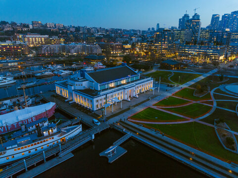 Seattle, United States - 04 December 2024: Aerial view of vibrant cityscape with MOHAI and marina at twilight, South Lake Union, Seattle, United States.