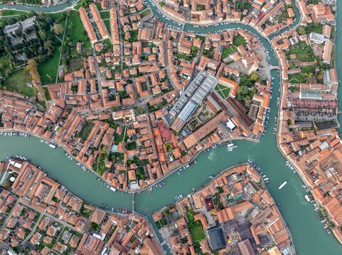Aerial view of picturesque canals and colorful rooftops in the historic old town, Murano, Italy.