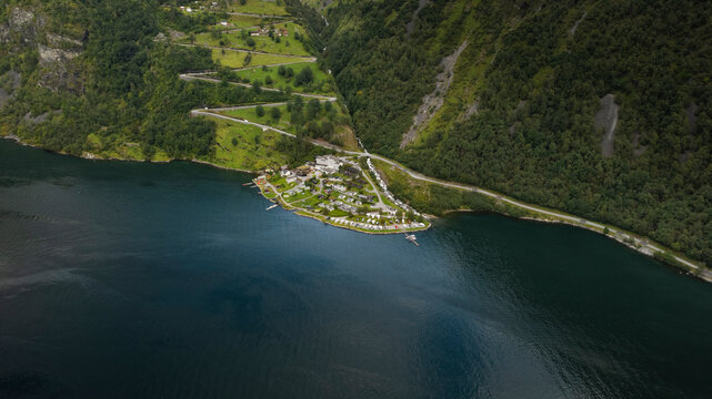 Aerial view of picturesque Gierangerfjord with tranquil blue water, lush greenery, and scenic mountains, More og Romsdal, Norway.