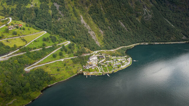 Aerial view of beautiful Gierangerfjord fiord with scenic coastline, mountains, and camping vehicles, More og Romsdal, Norway.